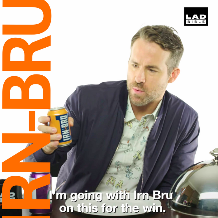 a ryan reynolds is holding a can of IRN BRU